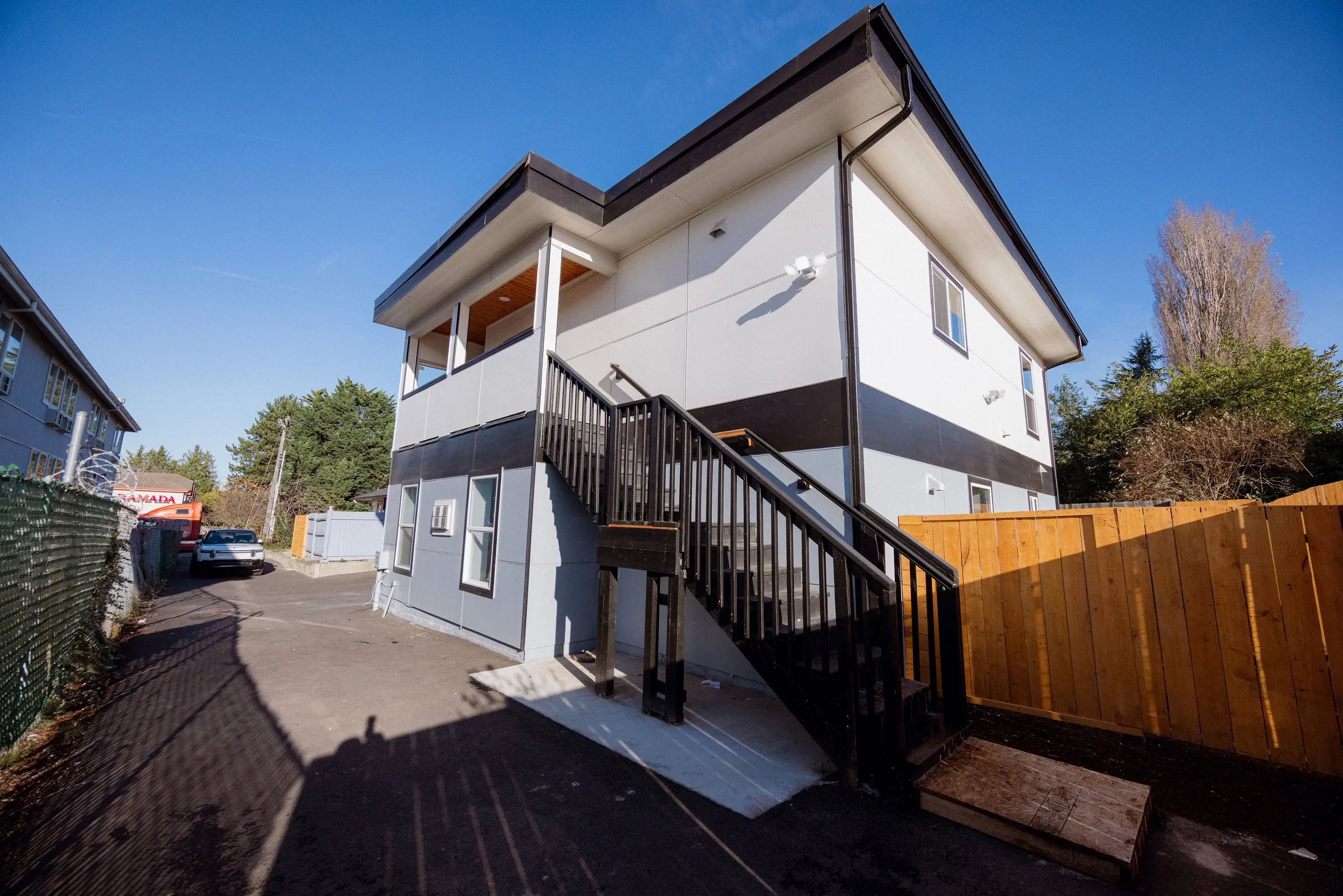 Rear elevation of the completed detached ADU, with a separate exterior staircase to the upper unit